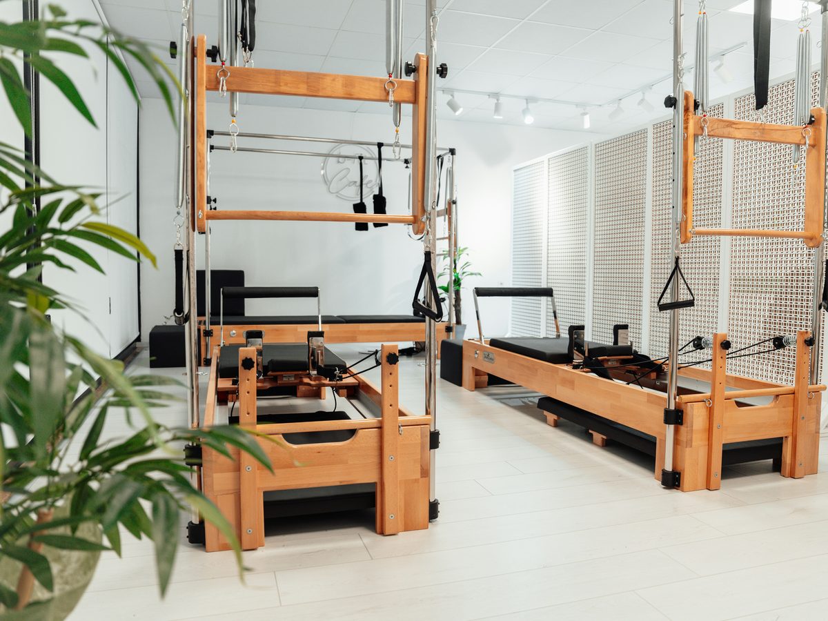 Wooden reformers in a bright studio with plants